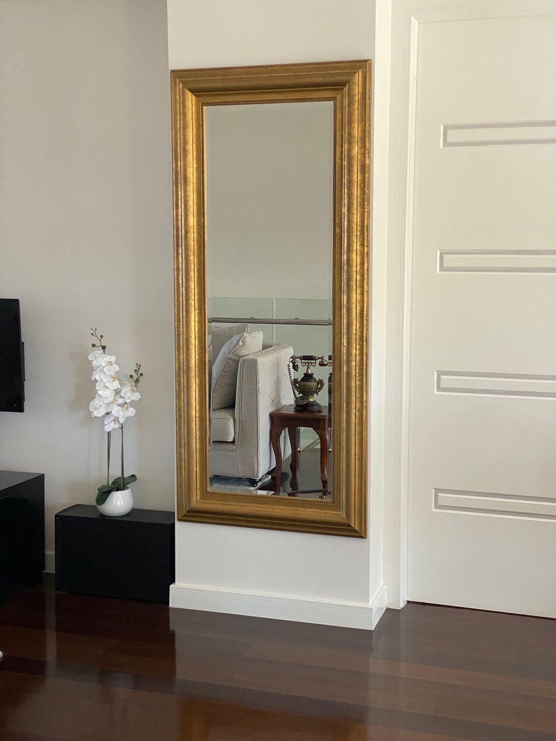 Framed mirror hung on a wall
